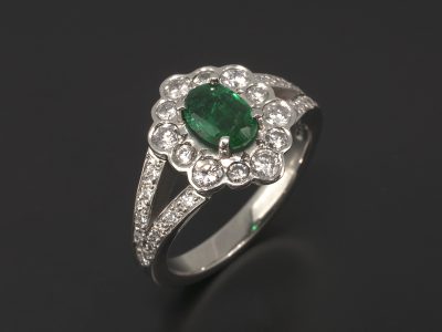 Ladies Emerald and Diamond Halo Engagement Ring, Platinum Claw and Pavé Set Design with Split Shoulder Detail, Oval Cut Emerald 0.73ct, Round Brilliant Cut Diamond Halo 0.55ct (12), Round Brilliant Cut Diamond Pavé Set Shoulder 0.13ct (18)