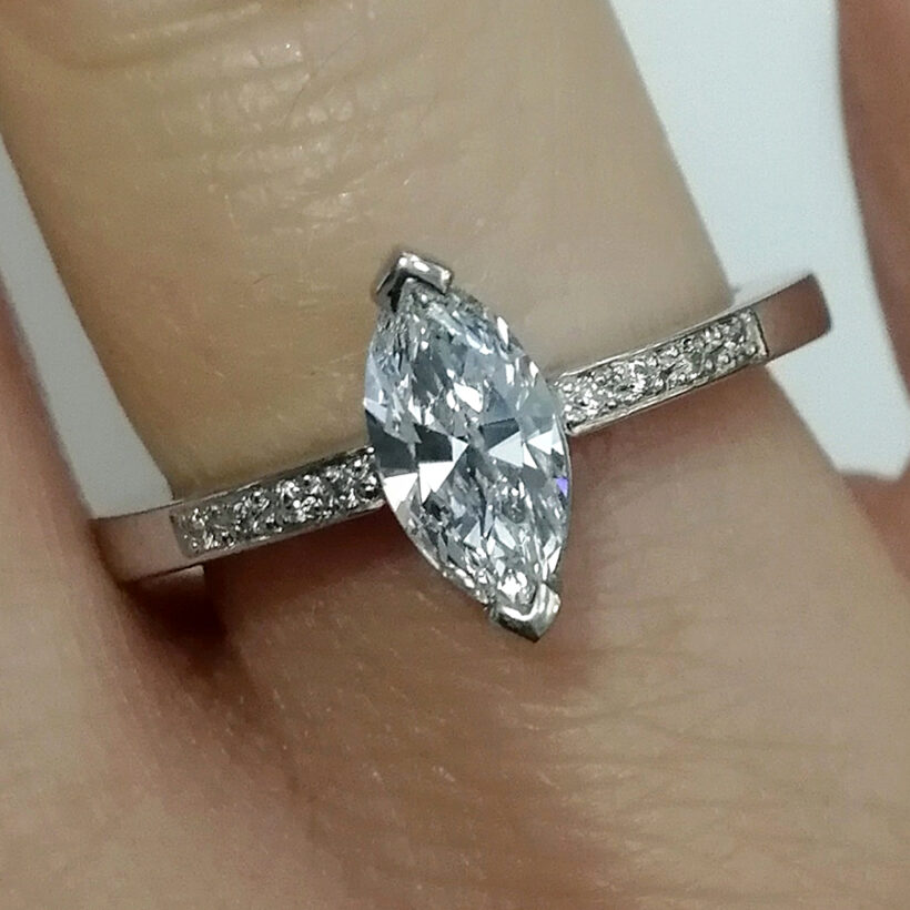 Platinum Claw and Pavé Set Engagement Ring with Marquise Cut 0.70ct D Colour SI1 Clarity