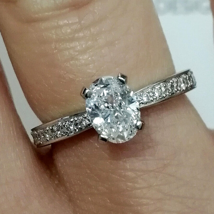 Oval Cut Diamond 0.71ct Engagement Ring in Platinum 4 Claw Setting With Pavé Shoulders