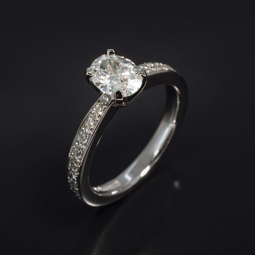 Oval Cut Diamond 0.71ct Engagement Ring in Platinum 4 Claw Setting With Pavé Shoulders