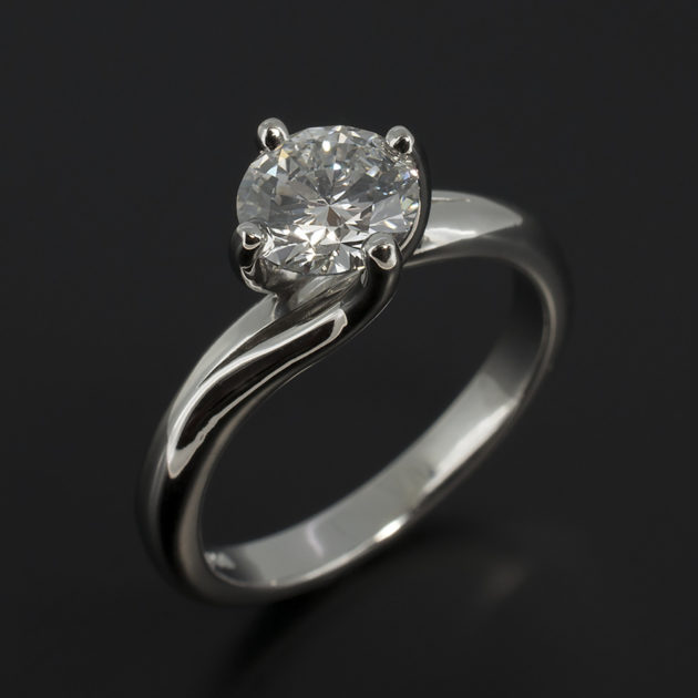Claw Set 0.90ct Diamond Solitaire Twist Design Platinum Engagement Ring
