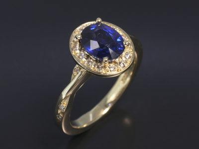 18kt Yellow Gold Oval Sapphire 1.56ct with Round Brilliant Cut Diamond 0.12ct (20) Halo & Twist Shoulder