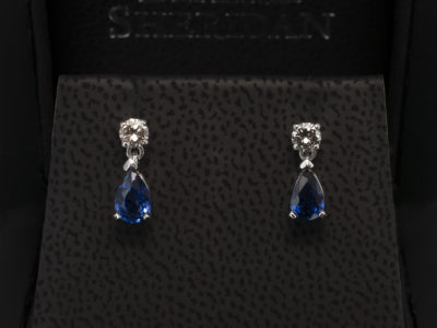 9kt White Gold Sapphire and Diamond Drop Earrings, Pear Cut Sapphires 0.89ct Total and Round Brilliant Cut Diamond 0.22ct