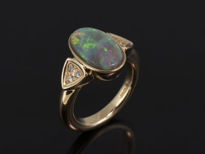 Ladies Diamond and Opal Dress Ring, 9kt Yellow Gold Rub over and Pavé Set Design, Opal 13 x 7.2mm, Round Brilliant Cut Diamond Side Stones (6) 0.09ct Total