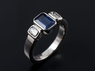 Emerald Cut Sapphire trilogy ring with Emerald cut diamond side stones