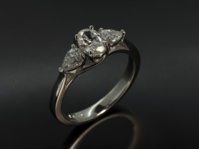 Ladies Trilogy Diamond Engagement Ring, Platinum Claw Set Design, Oval Cut Diamond Centre Stone 0.48ct, F Colour, SI Clarity, Pear Cut Diamond Side Stones 0.49ct x2, F Colour, SI Clarity, Lattice Detail