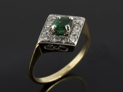 Oval Cut Emerald with Diamond Cluster White and Yellow Gold