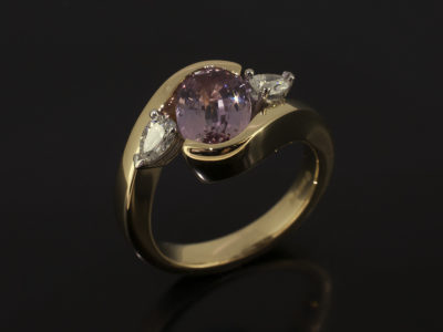 Oval Cut Peach Sapphire 2.27ct with Side Pear Cut Diamonds 0.31ct Total F Colour VS Clarity Minimum in and 18kt Yellow Gold and Platinum Twist Design