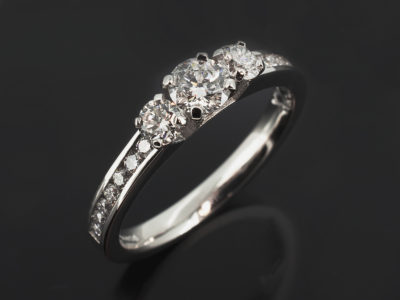 Ladies Trilogy Diamond Engagement Ring, Platinum 4 Claw and Channel Set Design, Round Brilliant Cut Diamond Centre Stone 0.40ct, F Colour, SI Clarity, Round Brilliant Cut Diamonds 0.35ct (2), F Colour, SI Clarity Min, Round Brilliant Cut Diamond Shoulders approx. 0.28ct (14)