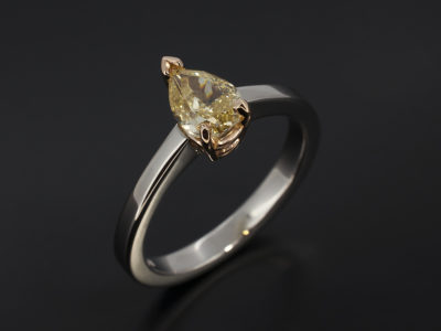 Pear Cut 0.78ct Fancy Yellow Diamond, Rose Gold and Palladium Claw Set