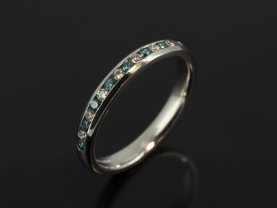 Ladies Blue and White Diamond Eternity Ring, Platinum Channel Set Design, Round Brilliant Cut Blue and White Diamonds 0.25ct Total