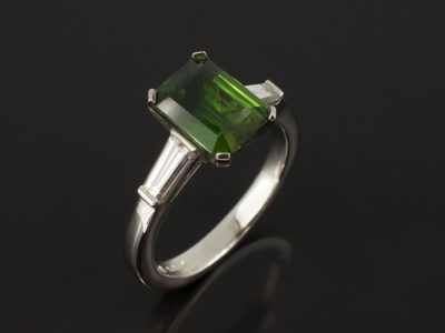 Platinum Claw Set Trilogy with Emerald Cut Green Tourmaline 2.07ct and Tapered Baguette Cut Diamonds 0.50ct Total