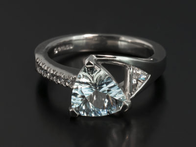 Ladies Aquamarine and Diamond Dress Ring, Platinum Claw Set Design, Trilliant Cut Aquamarine, 1.16ct. Trilliant Cut Diamond, 0.15ct, F Colour, SI Clarity Minimum, Round Brilliant Cut Diamond, 0.09ct (6), F Colour, SI Clarity Minimum