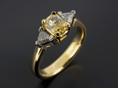 Emerald Cut Radiant Yellow Sapphire with Trilliant Cut Side Diamonds