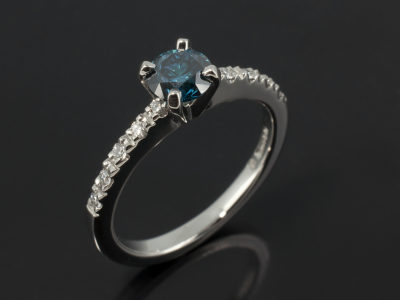 Round Brilliant Cut 0.56ct Blue Diamond in Palladium Claw Set Shoulders