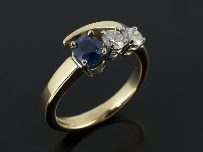 Sapphire 0.95ct with Round Brilliant Cut Diamonds 0.53 total 18kt Yellow Gold White Gold Twist