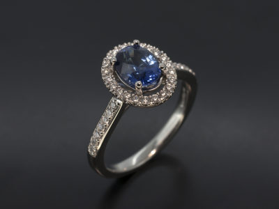 Oval Cut Sapphire with Diamond Halo & Shoulder