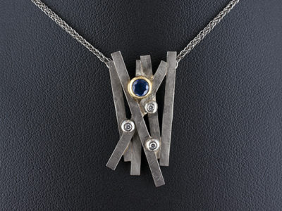 Palladium and Yellow Gold Rub over Set Sapphire and Diamond Crossover Design Pendant