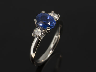 Platinum Trilogy Design with Oval Cut Sapphire 1.71ct and Round Brilliant Cut Diamonds 0.50ct Total