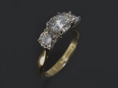Ladies Trilogy Diamond Engagement Ring, 18kt Yellow Gold and Platinum Claw Set Design, Round Brilliant Cut Diamond Centre Stone 0.70ct, E Colour, SI1 Clarity, Round Brilliant Cut Diamond Side Stones 0.60ct (2)