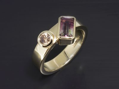 9kt Yellow Gold Rub over Set Design Dress Ring, Emerald Cut Watermelon Tourmaline, 1.26ct. Round Brilliant Cut Zircon, 0.52ct.