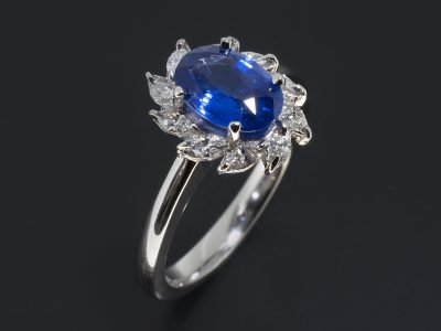 Bespoke sapphire ring, Platinum Claw Set Halo Design with Oval Cut Sapphire, 1.42ct and Marquise Cut Diamonds