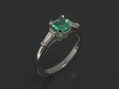 Platinum Claw Set Trilogy Design. Square Cut Green Emerald, 0.52ct. Tapered Baguette Lab Grown Diamonds, 0.30ct (2)