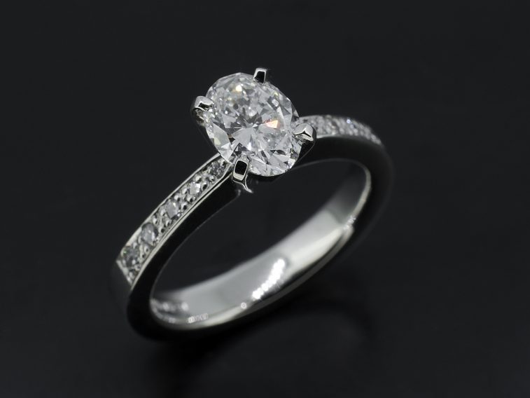 Platinum pave set oval diamond engagement ring 0.91ct