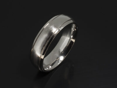 Platinum Court Shaped Gents Wedding Ring with Grooved Lines and a Brushed and Polished Finish