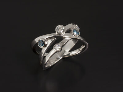 Platinum Cross Over Design Dress Ring with Round Brilliant Cut Treated Blue Diamonds 0.22ct and Round Brilliant Cut Diamonds 0.27ct F Colour VS Clarity Min