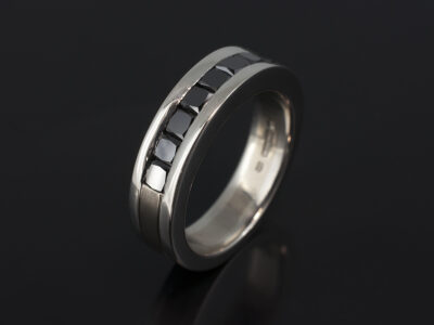 Platinum and 18kt White Gold Two Tone Gents Wedding Ring with Channel Set Square Black Diamonds