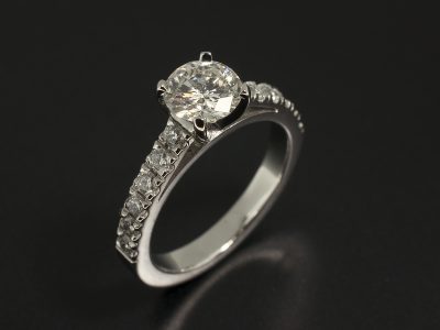 Ladies Solitaire Diamond Engagement Ring, Platinum 4 Claw and Castle Set Design, Round Brilliant Cut Diamond 0.71ct, H Colour, SI1 Clarity, Round Brilliant Cut Diamond Shoulder