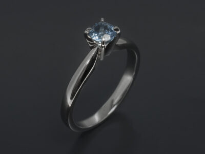 Platinum Claw Set Solitaire Design. Round Brilliant Cut Aquamarine, 0.41ct