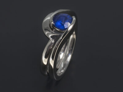 Platinum Half Rub Over Tension Set Twist Design Ladies Ring, Round Sapphire, 0.89ct. Platinum Fitted Twist Design