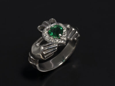 Platinum Claw and Pavé Set Claddagh Design with Hear Shaped Emerald 0.53ct and Round Brilliant Cut Diamonds 0.26ct Total