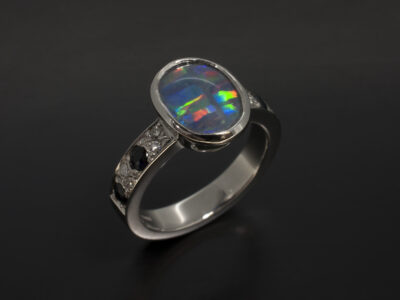 Platinum Rub Over and Pavé Set Design Ladies Ring with Cabochon Cut Opal, Round Brilliant Cut Diamonds 0.13ct and Round sapphires 0.41ct