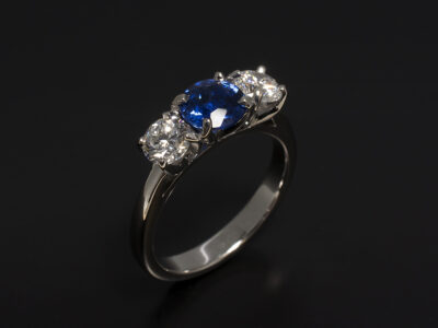 18kt White Gold Claw Set Trilogy Design with Round Brilliant Sapphire 1.05ct and Round Brilliant Cut Lab Diamonds 0.80ct Total