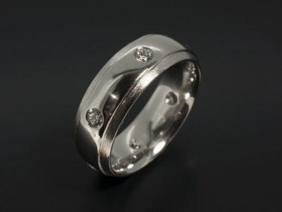 Gents Wedding Ring in Platinum Secret Set with Six Round Brilliant Cut Diamonds 0.67ct Total in a Polished and Flail Finish