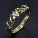 Ladies Diamond Sapphire and Amethyst Ring, 18kt Yellow Gold Rub over & Bead Set Design, Marquise Cut Diamond 0.10ct F Colour VS Clarity Minimum, Marquise Cut Sapphires, 0.33ct (2). Round Brilliant Cut Sapphires, 0.16ct (2). Round Brilliant Cut Amethysts, 0.12ct (2)