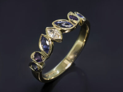 Ladies Diamond Sapphire and Amethyst Ring, 18kt Yellow Gold Rub over & Bead Set Design, Marquise Cut Diamond 0.10ct F Colour VS Clarity Minimum, Marquise Cut Sapphires, 0.33ct (2). Round Brilliant Cut Sapphires, 0.16ct (2). Round Brilliant Cut Amethysts, 0.12ct (2)