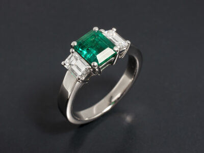 Ladies Emerald and Diamond Ring, 18kt White Gold Claw Set Trilogy Design, Emerald Cut Emerald 1.13ct, Emerald Cut Diamonds 0.83ct Total F Colour VS Clarity Min