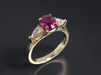 Ladies Ruby and Diamond Trilogy Engagement Ring, 18kt Yellow Gold Claw Set Design, Oval Cut Ruby 1.60ct, Pear Cut Diamonds 0.50ct Total F Colour VS Clarity Min.
