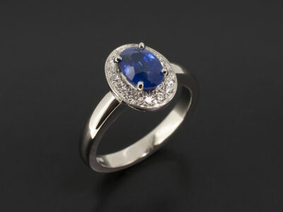 Ladies Sapphire and Diamond Dress Ring, Platinum Claw and Pavé Set Halo Design , Oval Cut Sapphire 1.04ct, Round Brilliant Cut Diamonds