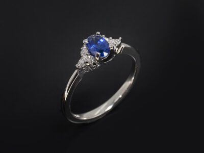 Ladies Trilogy Sapphire & Diamond Ring, Platinum Claw Set Oval Cut Sapphire, 0.57ct., Round Brilliant Cut and Marquise Cut Lab Diamond Sides, F Colour VS Clarity