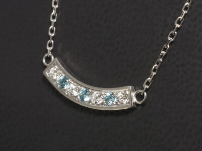 White Gold Pavé Set Blue Zircon and Diamond Pendant, Round Brilliant Cut Diamonds and Blue Zircons in Curved Design on a16-18 Inch Angled Filed Trace Chain