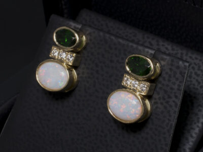 18kt Yellow Gold Rub over and Pavé Set Tsavorite and Diamond Stud Earrings, Oval Tsavorites, 6 x 4mm (2), Round Brilliant Cut Diamonds 0.15ct (6), Oval Opals, 8 x 6mm (2)