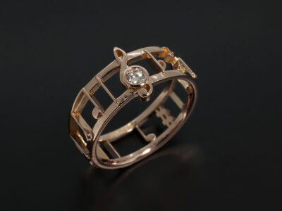 Ladies Diamond Engagement Ring, 18kt Rose Gold Musical Note Design, Round Brilliant Cut Secret Set Diamond 0.05ct