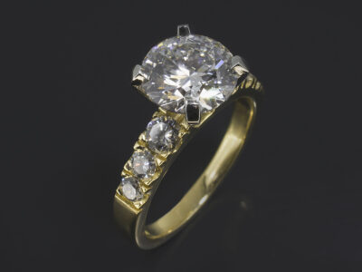 Ladies Diamond Engagement Ring, 18kt Yellow Gold and Platinum Claw and Castle Set Design, Round Brilliant Cut Diamond 2.19ct, Round Brilliant Cut Diamond Shoulders approx. 0.50ct (6)