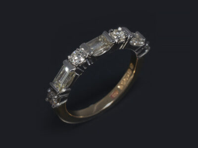 Ladies Diamond Eternity Ring, Platinum and 18kt Yellow Gold Claw and Rub over Set Design, Round Brilliant Cut Diamonds 0.28ct (4), Baguette Cut Diamonds 0.66ct, G-H Colour, SI Clarity