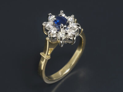 Ladies Sapphire and Diamond Cluster Dress Ring, Platinum and Yellow Gold Design, Oval Cut Sapphire, Round Brilliant Cut Diamonds